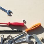 red and silver hand tool