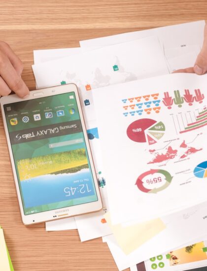 person holding white Samsung Galaxy Tab