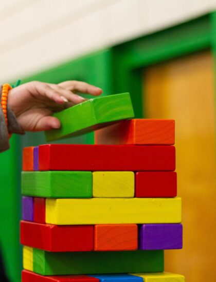 person piling blocks