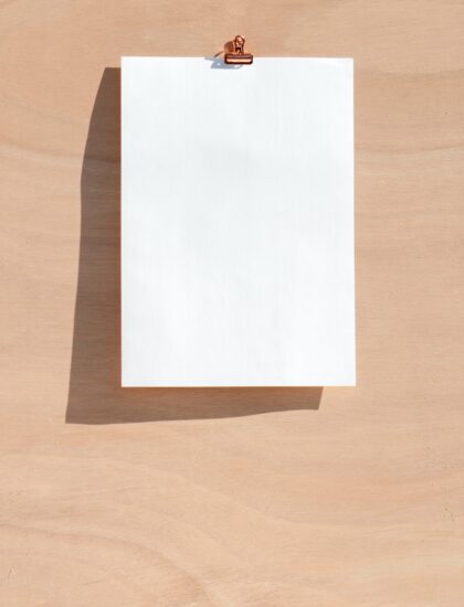 white printer paper on brown wooden table