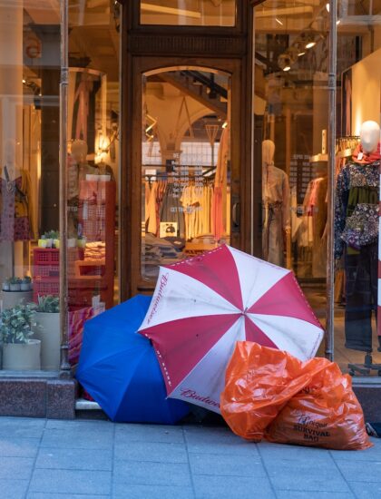 Photo by Dan Burton red and white umbrella beside plastic bag